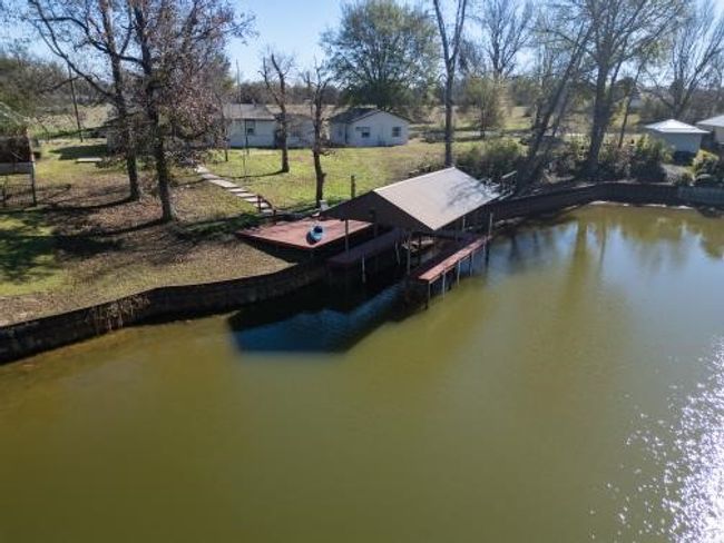 Dock area featuring a water view | Image 9