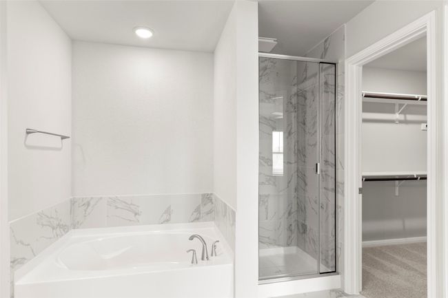 Full bath with a walk in closet, a marble finish shower, and a garden tub | Image 24