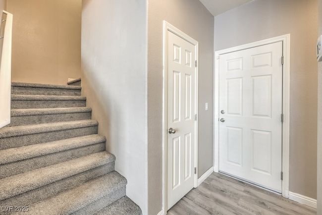 Stairs with baseboards and wood finished floors | Image 34