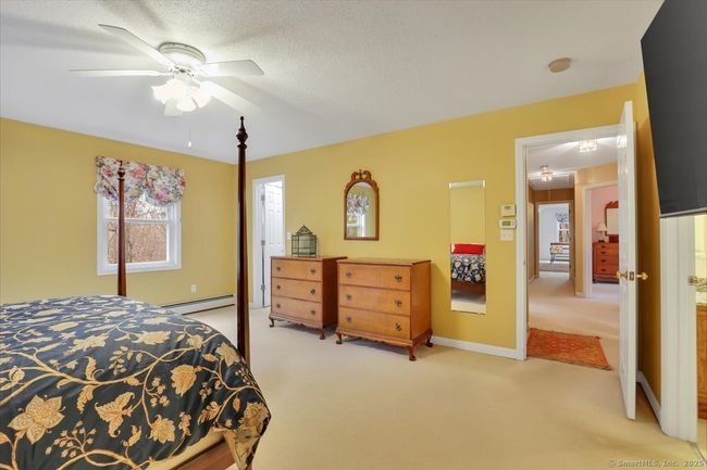 Primary en-suite bedroom with walk-in closet, full bathroom, and dressing room or second walk-in closet. | Image 16