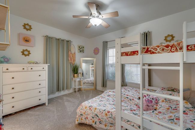 Carpeted bedroom with ceiling fan | Image 17