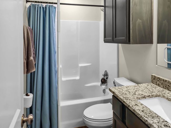Full bathroom with vanity and shower / bath combination with curtain | Image 24