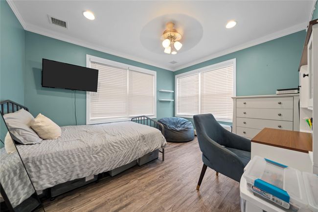Bedroom with light carpet | Image 36