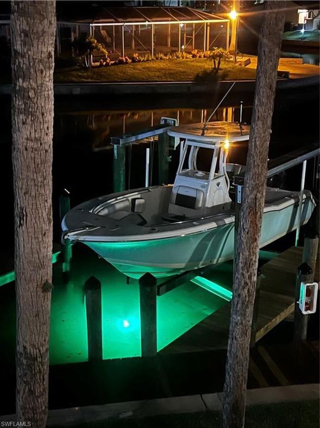 View of boat lift and slip at night | Image 25