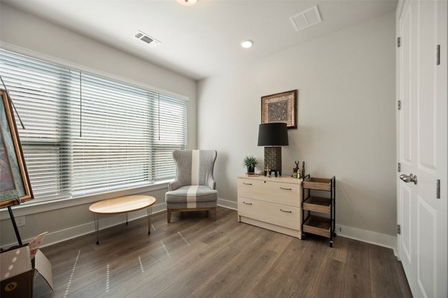 Sitting room with wood finished floors and recessed lighting | Image 9