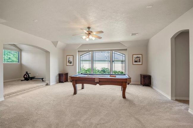 Upstairs you will find a huge gameroom, 20 x 18 - which is spacious enough for many versatile options, it has a secret closet, study nook as well. | Image 26
