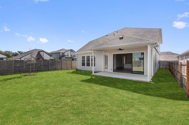 Back of house featuring a patio area, a fenced backyard, and a shingled roof | Image 39
