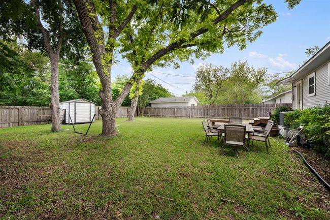 Backyard with storage shed. | Image 31