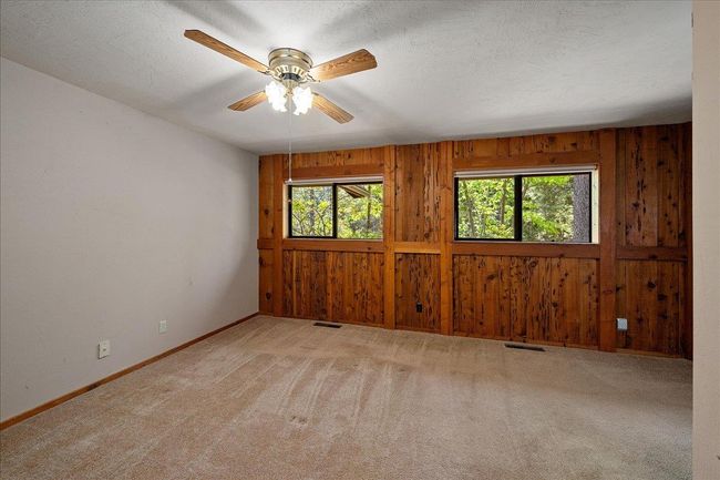 Master bedroom with pecky cedar accents. | Image 34