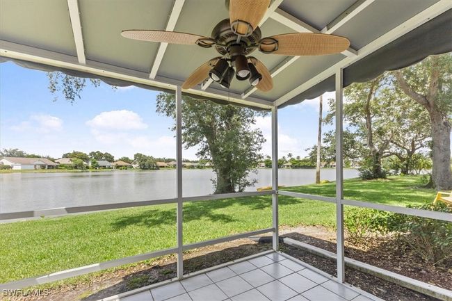 Unfurnished sunroom with a water view and ceiling fan | Image 9
