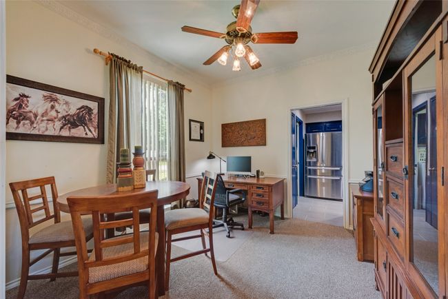 Office featuring ceiling fan, light colored carpet, and crown molding | Image 6