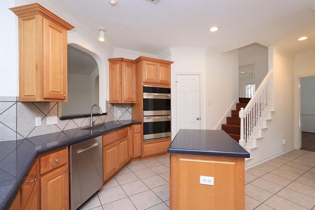 Spacious pantry and back staircase to second floor. | Image 16