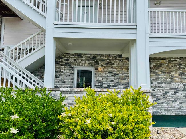 Entrance to property featuring brick siding | Image 36
