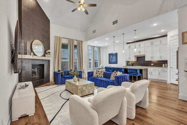 Another angle of this inviting family room with the view of the kitchen. | Image 11