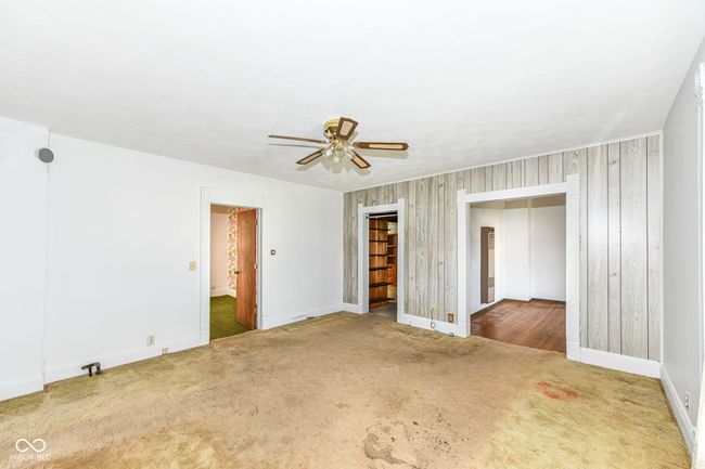 Reverse angle of living room leading the dinning room and hallway | Image 8