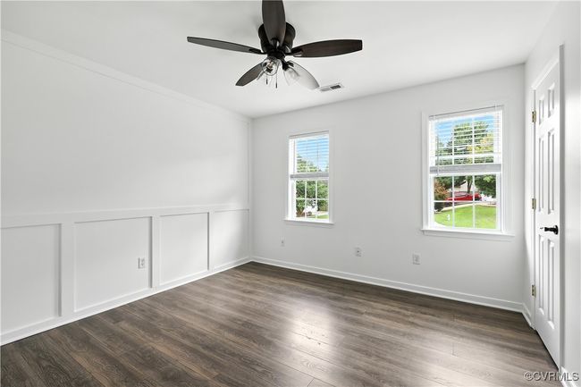 2nd bedroom with Laminate-style floors and ceiling fan | Image 23