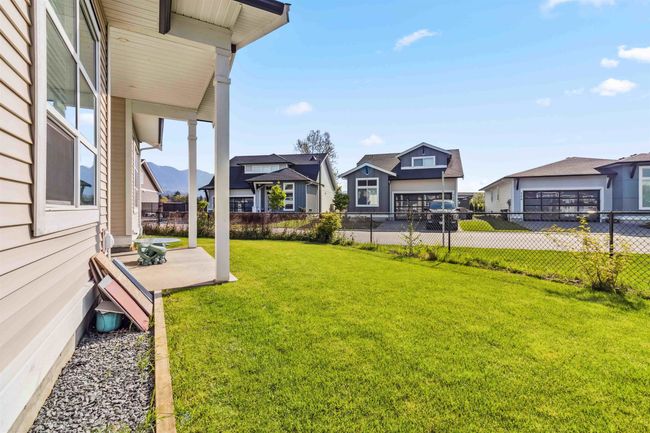 View of yard with a residential view, a patio, and fence | Image 14