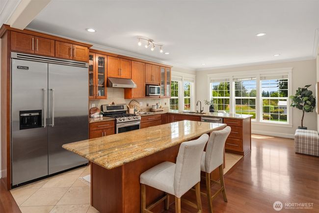 Kitchen with breakfast nook on the far side | Image 10