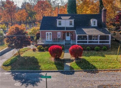 Tudor Style home with front porch and extraordinary curb appeal | Image 1