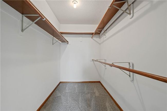 Walk in closet with carpet flooring | Image 20