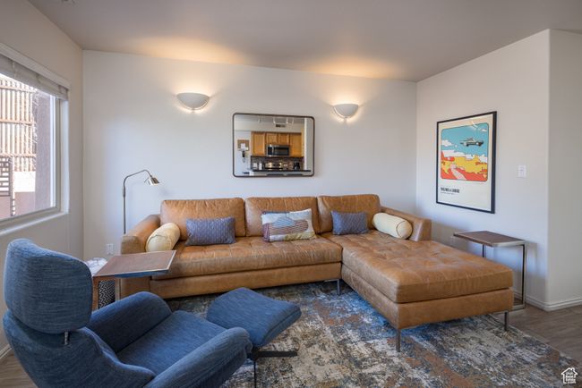 Living room with dark wood-type flooring | Image 13