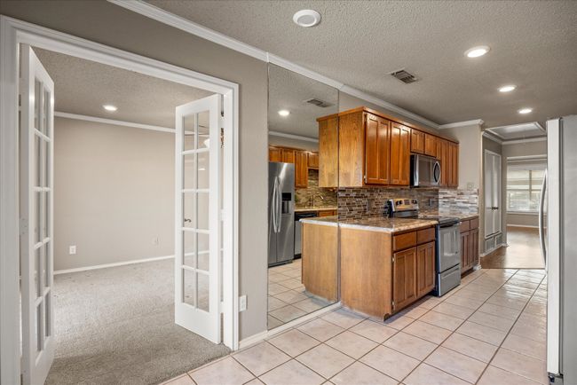 French doors to large Primary Bedroom | Image 17