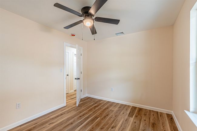 Unfurnished room with light wood-style floors, visible vents, a ceiling fan, and baseboards | Image 18