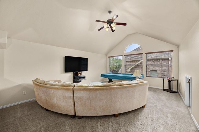 At the top of the stairs you have a media room wired for sound. A large enough space for multiple uses. The pool table is being given to the buyer of this home. | Image 24