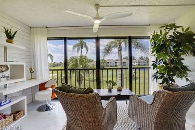 Sunroom featuring ceiling fan | Image 2