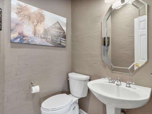 Half bathroom with toilet and a sink | Image 17