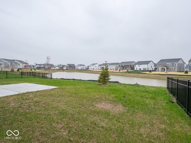 view of yard with a water view, a residential view, and fence | Image 50