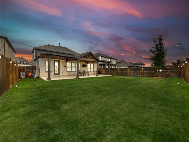 Back of property at dusk with a patio area | Image 30