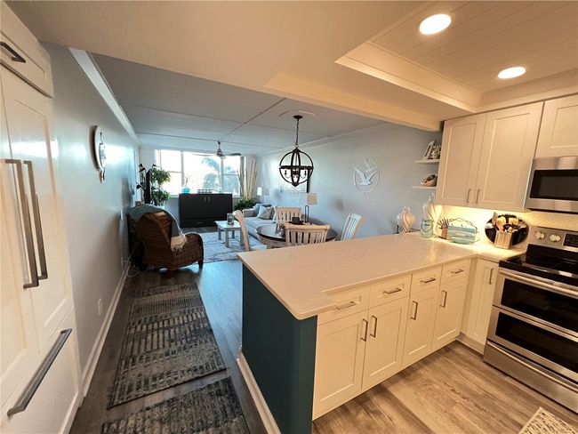Kitchen opens to dining/living | Image 4