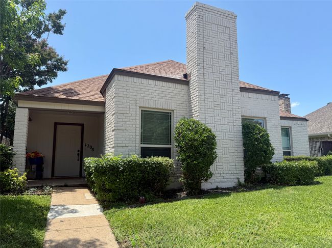 View of front of house with a shingled roof, a front lawn, a chimney, and brick​​‌​​​​‌​​‌‌​‌‌​​​‌‌​​‌‌​‌​​​​​‌ siding | Image 29