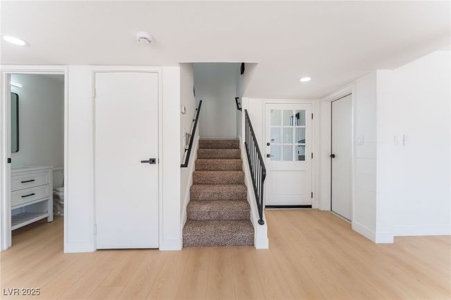 Stairs featuring wood finished floors and recessed lighting | Image 23