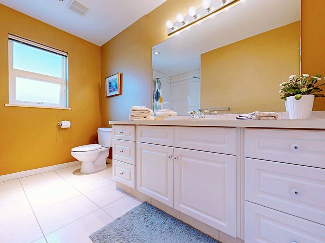 Full bath featuring vanity, tile patterned floors, and curtained shower | Image 27