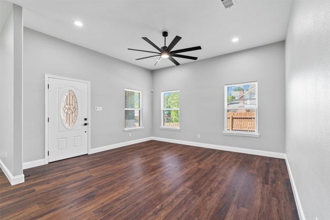 Living room with ceiling fan | Image 8