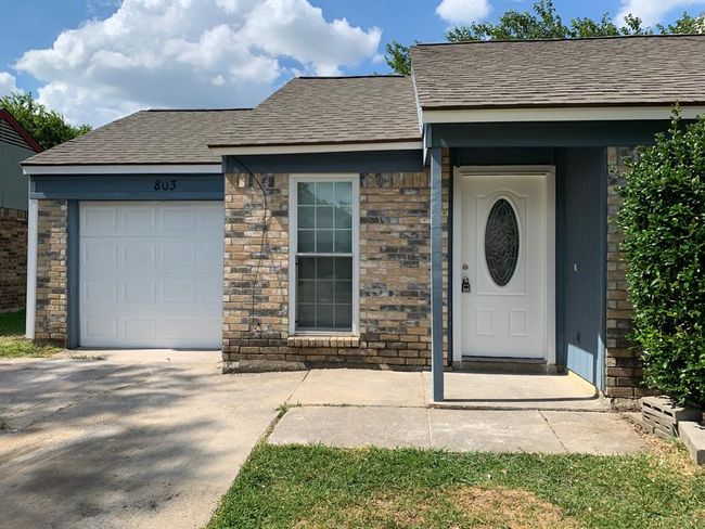 Entrance to property featuring a garage | Image 2