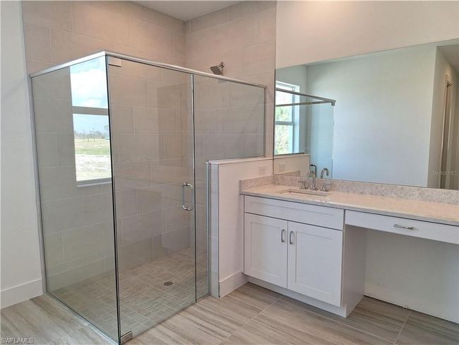 Primary bathroom with luxe walk-in shower | Image 13
