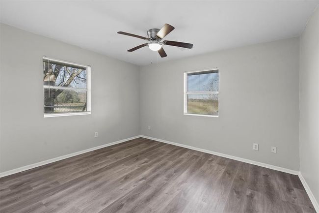 All secondary bedrooms have a ceiling fan. | Image 17