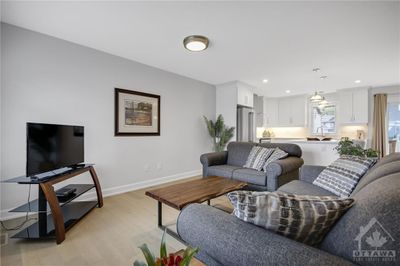 Living Room is open to the kitchen and dining area | Image 3