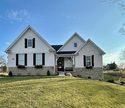 View of front of home featuring a front yard | Image 1