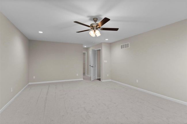 Carpeted empty room with ceiling fan | Image 7