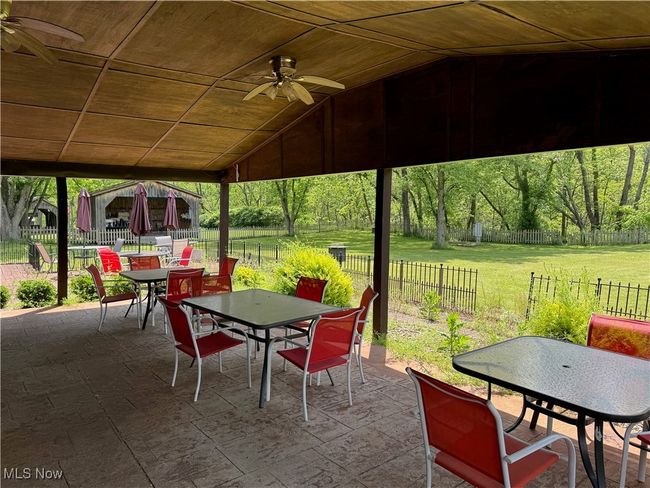 View of patio / terrace featuring outdoor dining space and ceiling fan | Image 44