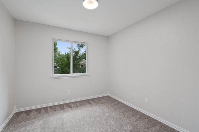Carpeted spare room with baseboards | Image 19