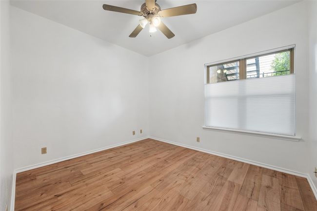 Spare room featuring wood-type flooring and ceiling fan | Image 24