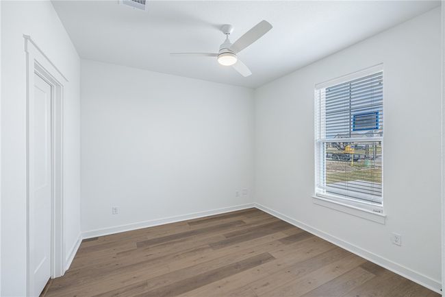 Empty room with ceiling fan and hardwood / wood-style floors | Image 22
