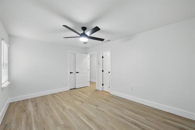 Unfurnished bedroom featuring light wood-type flooring and baseboards | Image 32