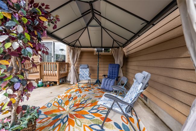 Wooden deck with a patio area | Image 28