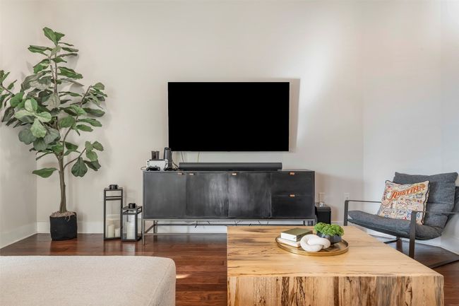 Living area featuring dark wood-style floors | Image 21